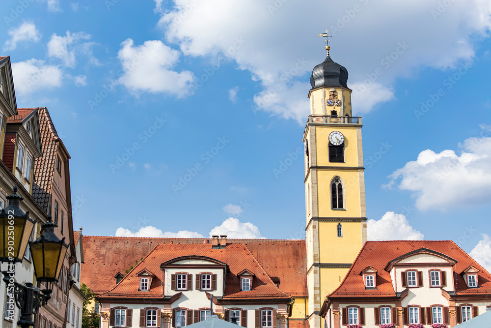 In the main square of a small town overlooking the tower of its beautiful church, in the middle of the Romantic Road. In Bad Mergentheim, Bavaria, Germany.