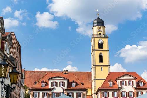 Fototapeta Naklejka Na Ścianę i Meble -  In the main square of a small town overlooking the tower of its beautiful church, in the middle of the Romantic Road. In Bad Mergentheim, Bavaria, Germany.