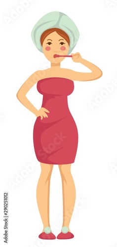 Morning routine, girl brushing teeth wrapped in towel