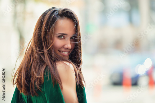 Εκτύπωση καμβά Young pretty likable cheerful woman posing summer city outdoor