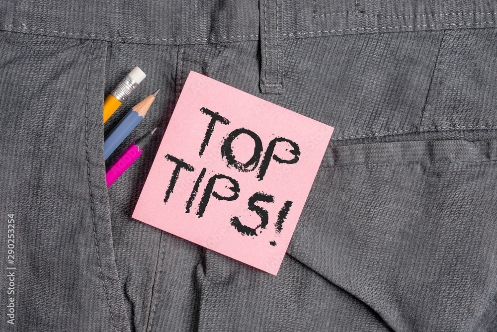 Conceptual hand writing showing Top Tips. Concept meaning small but particularly useful piece of practical advice Writing equipment and pink note paper inside pocket of trousers Conceptual hand writing showing Top Tips. Concept meaning small but particularly useful piece of practical advice Writing equipment and pink note paper inside pocket of trousers
