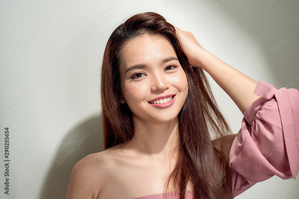 young girl posing against a concrete wall, dressed in pink, hard light and shadows young girl posing against a concrete wall, dressed in pink, hard light and shadows