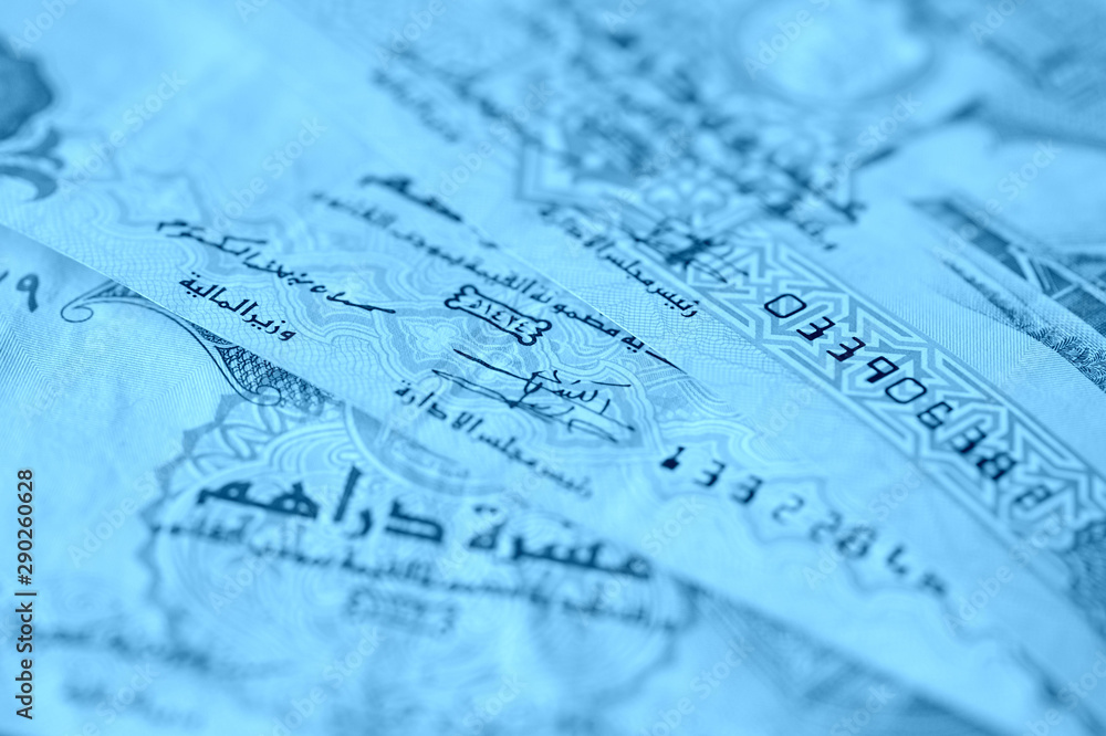 United Arab Emirates banknotes close up blue color toned United Arab Emirates banknotes close up blue color toned
