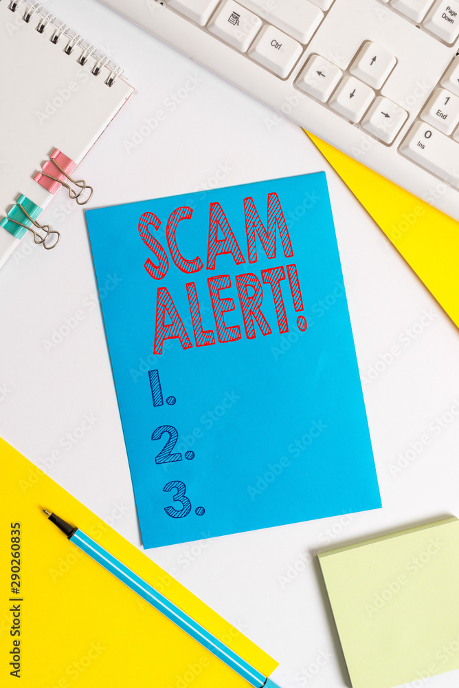 Conceptual hand writing showing Scam Alert. Concept meaning fraudulently obtain money from victim by persuading him Colored paper binder clip sheets white desk empty space Conceptual hand writing showing Scam Alert. Concept meaning fraudulently obtain money from victim by persuading him Colored paper binder clip sheets white desk empty space