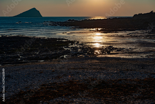 Sunset over Wembury beach with the Mewstone in the distance photo