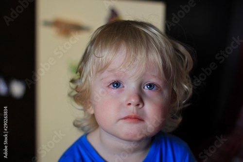 Portrait of a crying boy. Kid with sad expression. Emotions on the face of baby.
