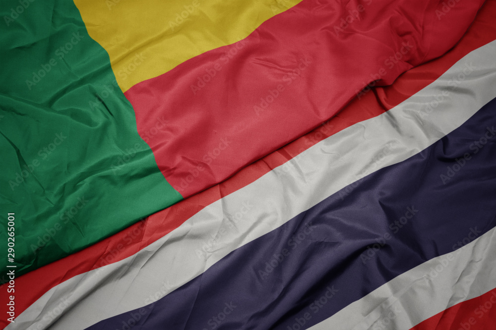 waving colorful flag of thailand and national flag of benin.