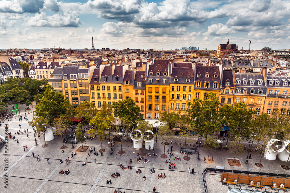 Aerial view of Pompidou square and residential houses. Eiffel tower at the distance. Paris travel and lifestyle concept