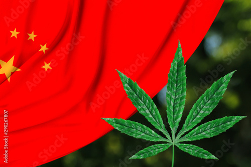 Photography green leaf of hemp and the beautiful silk national flag of China, the concept of