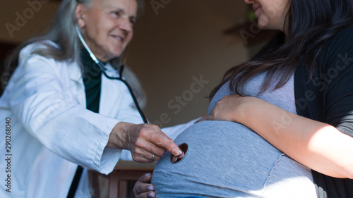 Wallpaper Mural Female doctor examined pregnant woman with a stethoscope Torontodigital.ca