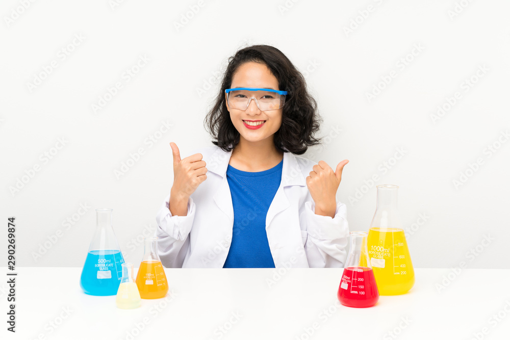 Young scientific asian girl giving a thumbs up gesture Young scientific asian girl giving a thumbs up gesture