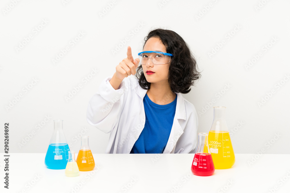 Young scientific asian girl touching on transparent screen Young scientific asian girl touching on transparent screen