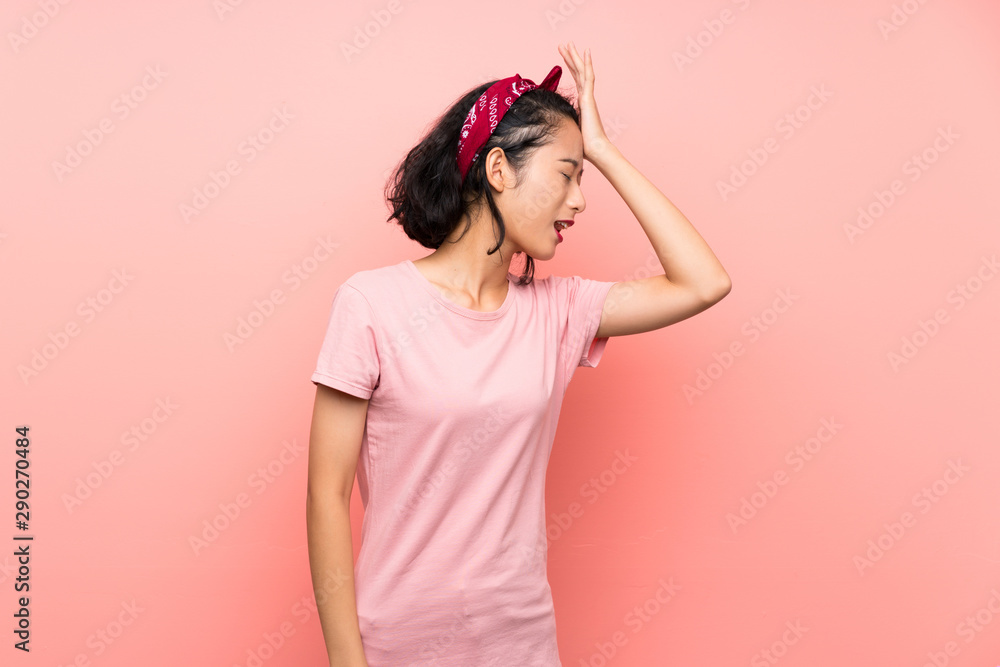 Asian young woman over isolated pink background has realized something and intending the solution Asian young woman over isolated pink background has realized something and intending the solution