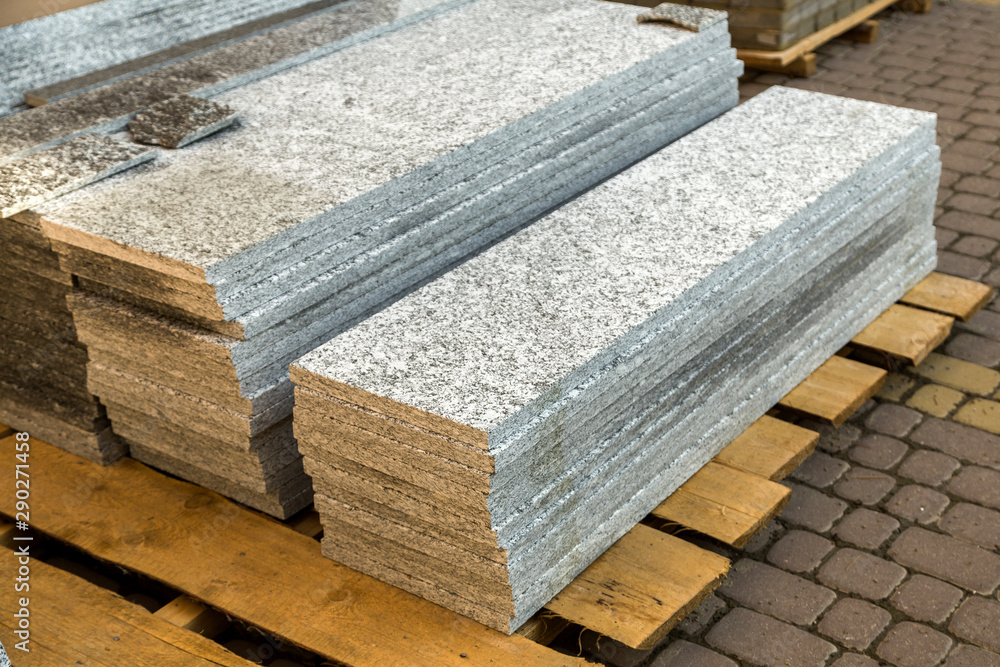 Piles of granite marble slabs. Stone sheets for decorative construction. Piles of granite marble slabs. Stone sheets for decorative construction.