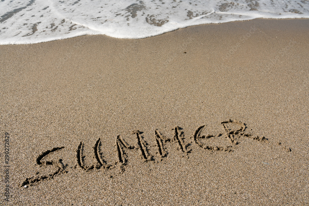 Fototapeta premium Summer, word written on the beach