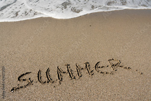 Summer, word written on the beach