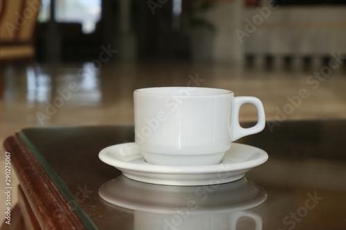 Coffee or tea in a white cup and saucer. The hotel is all-inclusive. Break in the waiting room.