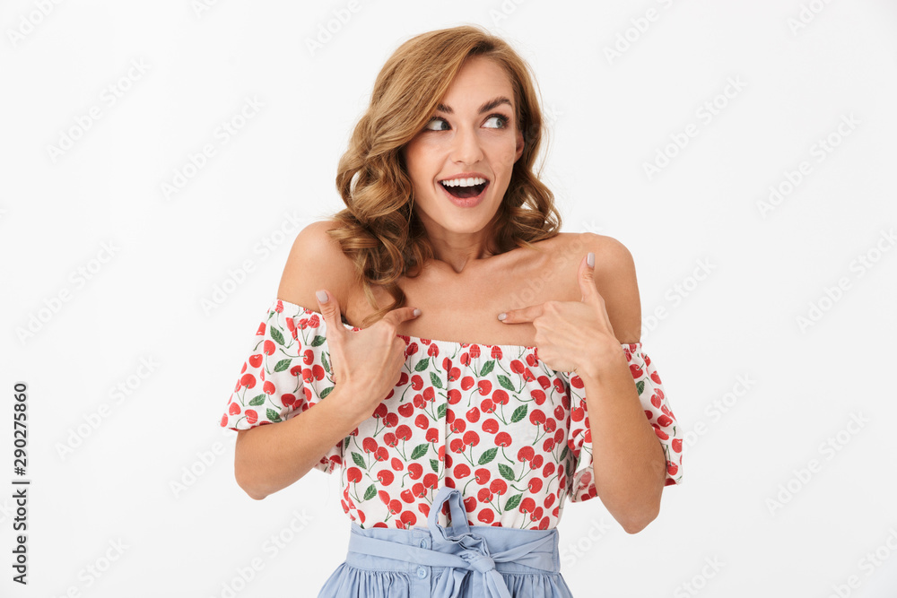 Cheery woman posing isolated over white wall background pointing to hersef. Cheery woman posing isolated over white wall background pointing to hersef.