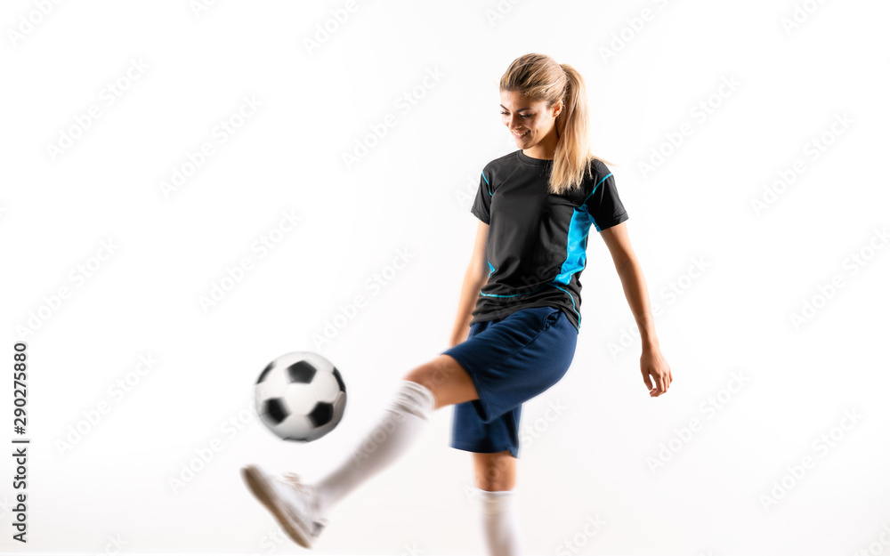 Fototapeta premium Blonde football player teenager girl over isolated white backgro