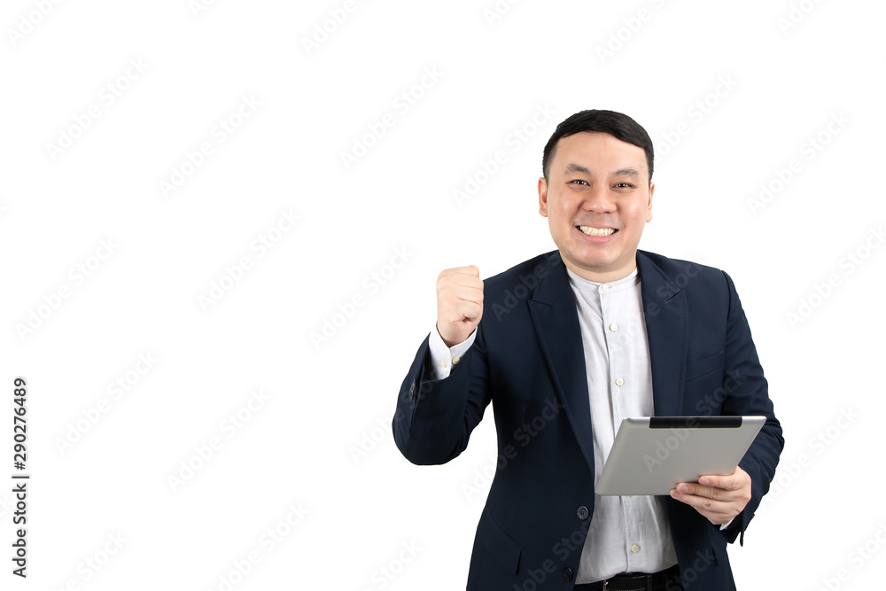 Young Asian businessman holding digital tablet with fist hand, celebrating success isolated on white background with copy space. Technology, online marketing, e-commerce or startup concept. Young Asian businessman holding digital tablet with fist hand, celebrating success isolated on white background with copy space. Technology, online marketing, e-commerce or startup concept.