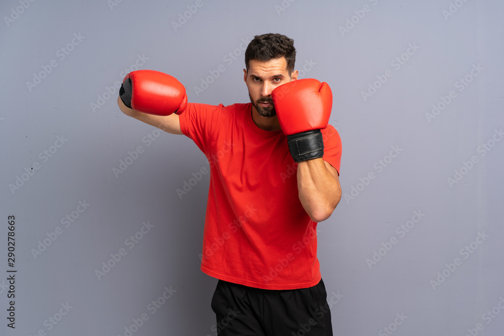 Young sport man with boxing gloves Young sport man with boxing gloves