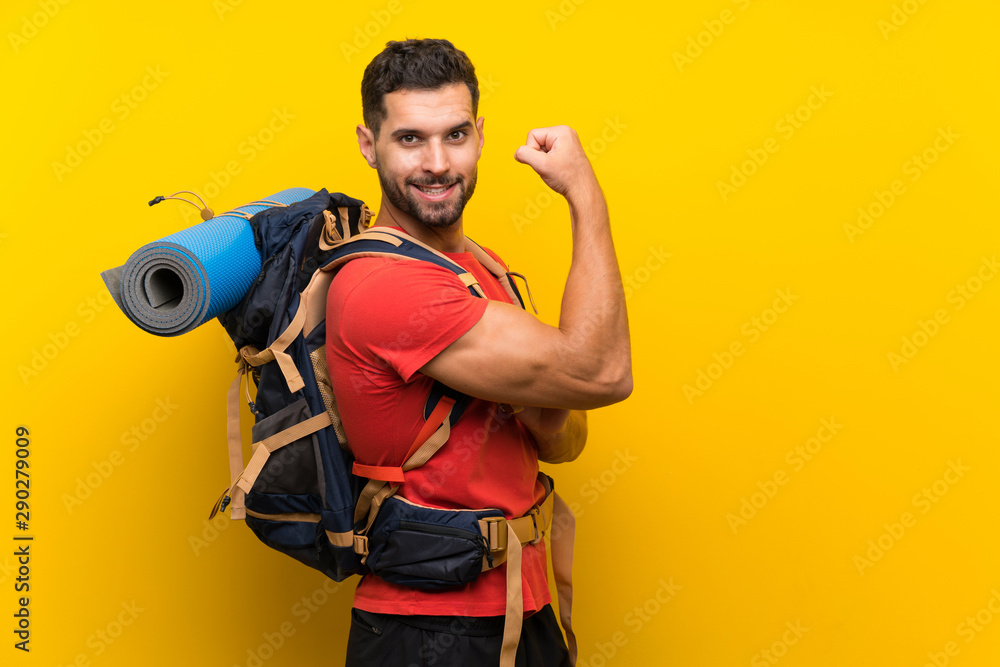 Young hiker man making strong gesture Young hiker man making strong gesture