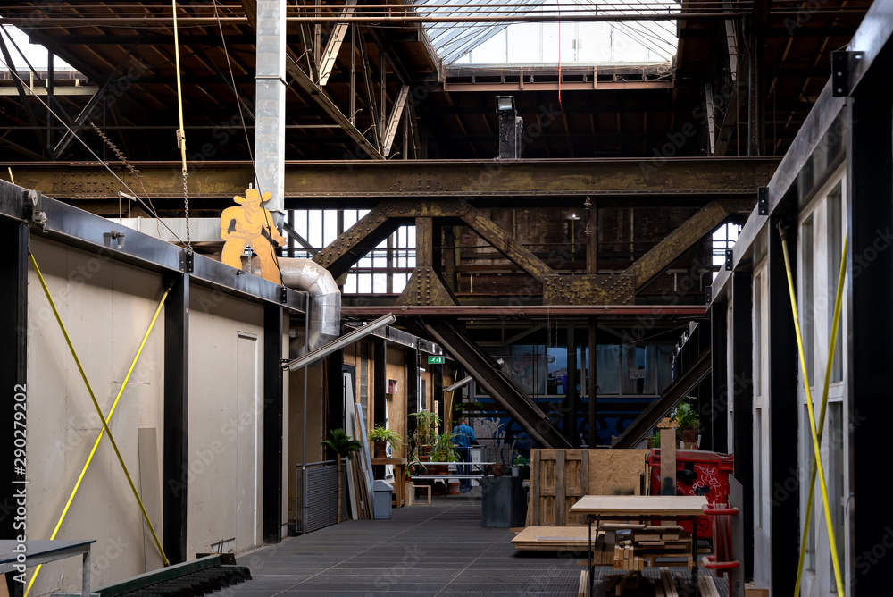 Naklejka premium workshops and ateliers in Kunststad or the City of Art in NSDM Wharf on the banks of the River IAmsterdam, Netherlands - June 01, 2019: Images of workshops and ateliers in Kunststad 