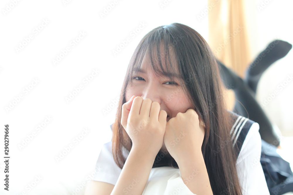 Portrait japanese school girl in white tone bed room Portrait japanese school girl in white tone bed room