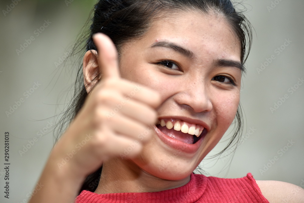 Youthful Minority Girl With Thumbs Up Youthful Minority Girl With Thumbs Up