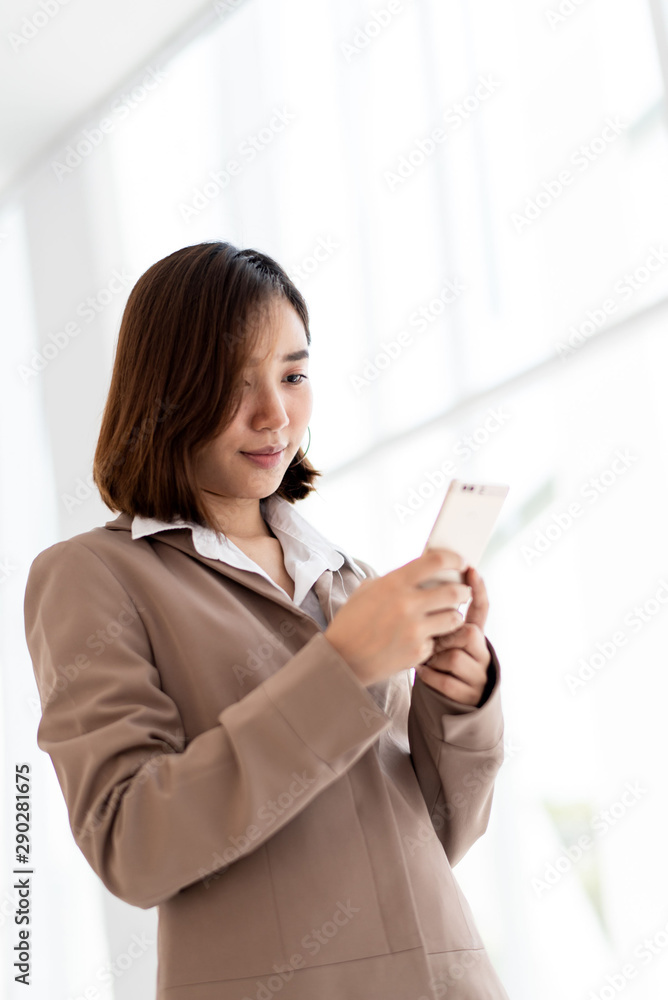 Business woman use a smartphone Business woman use a smartphone