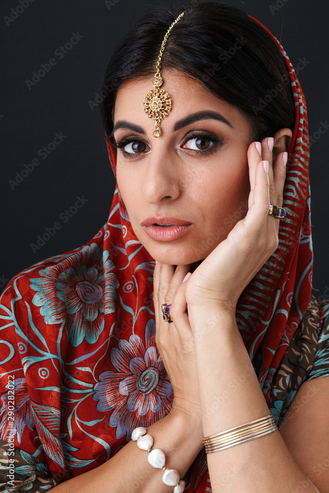 Image of lovely hindus girl wearing traditional indian saree dress and ethnic  jewelry covering her head with dupatta scarf Stock Photo | Adobe Stock