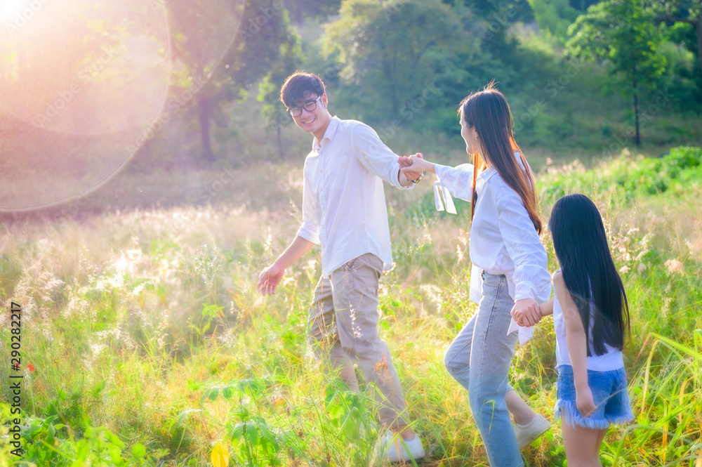 group of family holding hand together walks to the successfully light of destination group of family holding hand together walks to the successfully light of destination