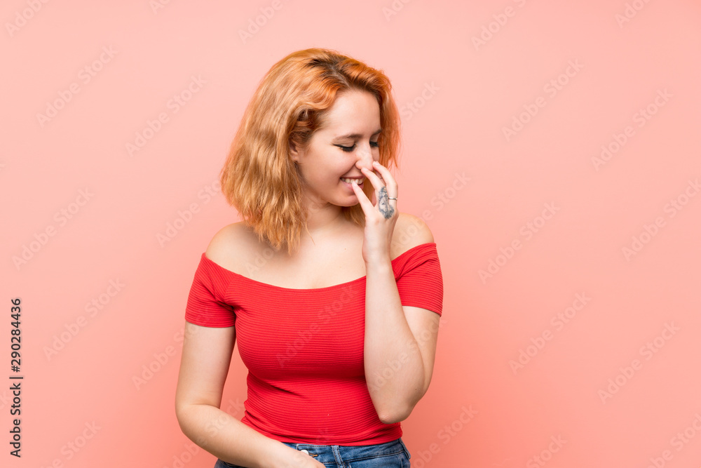 Young woman over isolated pink background smiling a lot Young woman over isolated pink background smiling a lot