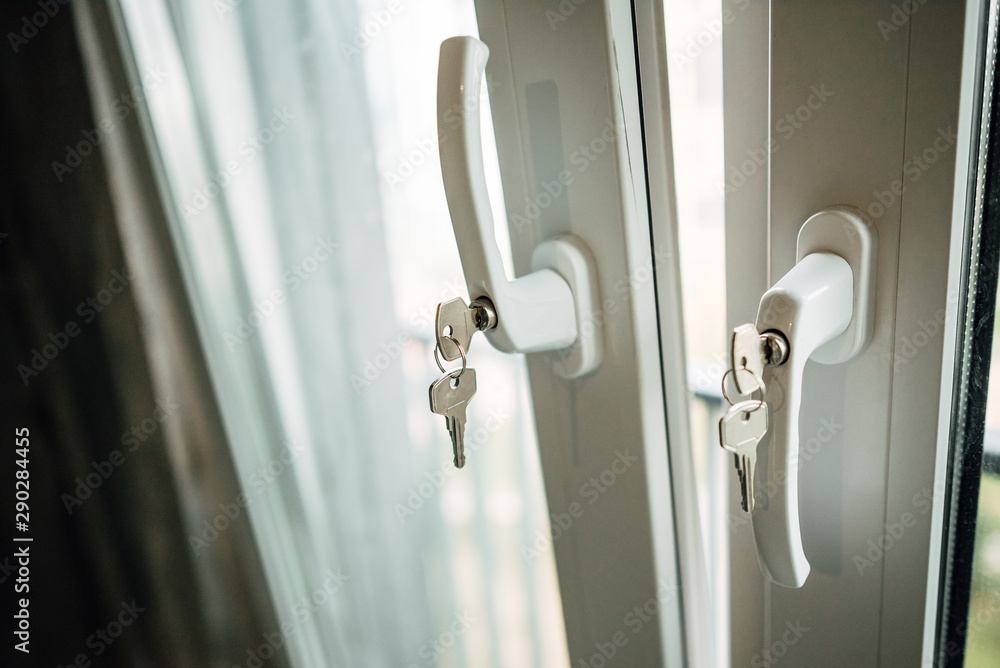 Naklejka premium key in the handle of plastic window