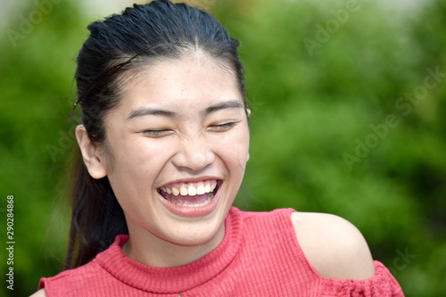 An Asian Girl And Laughter