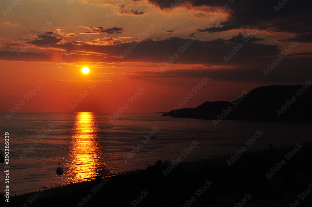 Very beautiful sunset over the sea in the early summer.