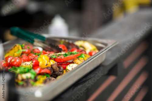 Freshly cooked hot and spicy grilled vegetables in metallic bowl