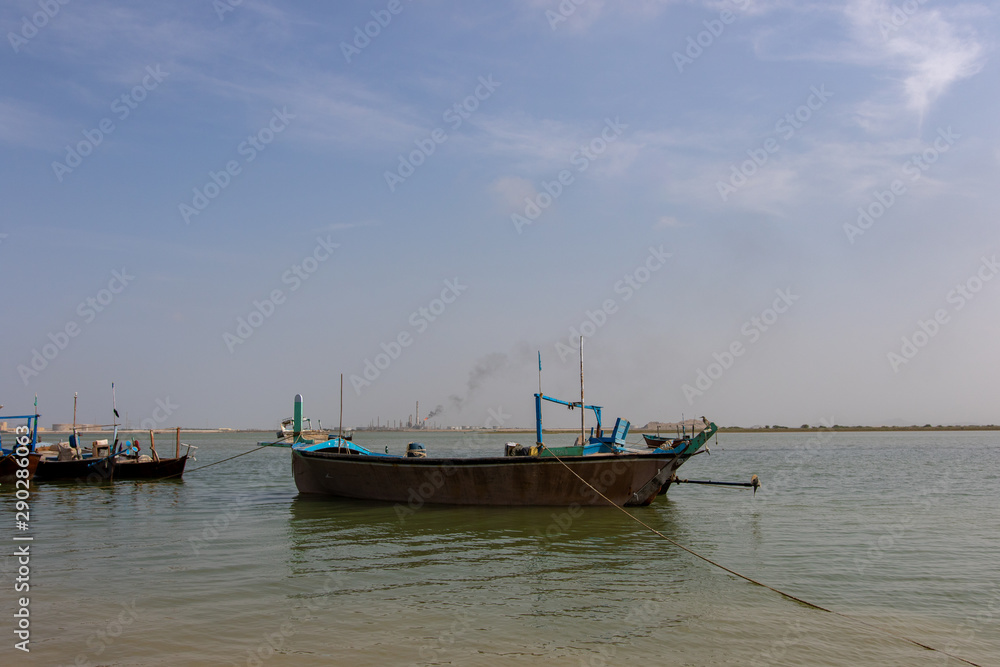 Empty fishing boats on coastline 