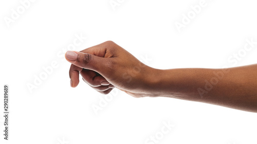 Slika na platnu African american woman holding something in fist, ready to share