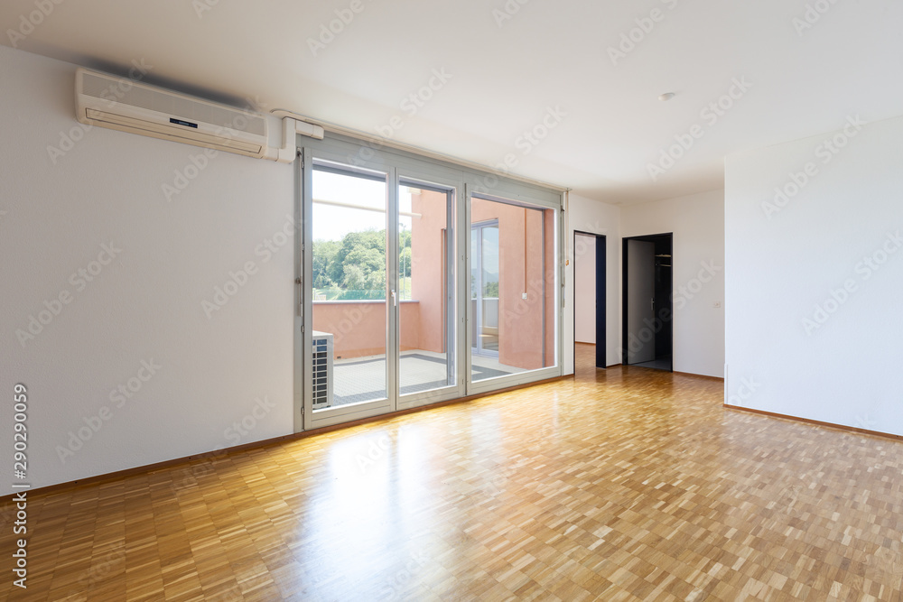 Empty room with white walls and window with balcony. Empty room with white walls and window with balcony.