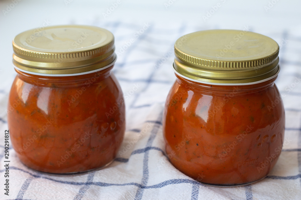 tomato sauce with herbs in a jar tomato sauce with herbs in a jar