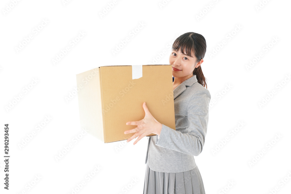 荷物を運ぶ若いビジネスウーマン 荷物を運ぶ若いビジネスウーマン