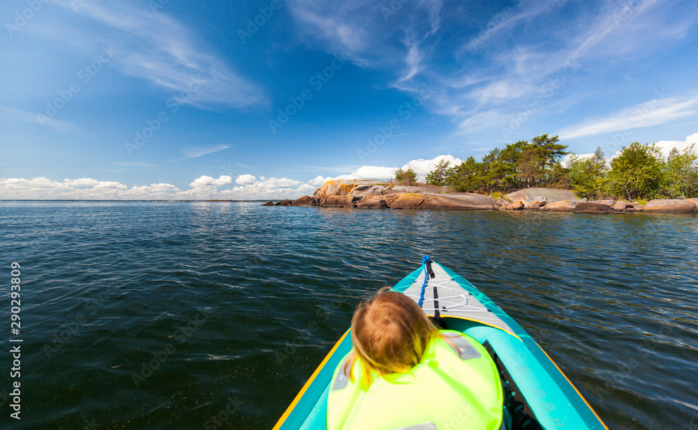 Kayaking at sea with child. Kajak fahren mit Kind vor Meeresküste. Kayaking at sea with child. Kajak fahren mit Kind vor Meeresküste.