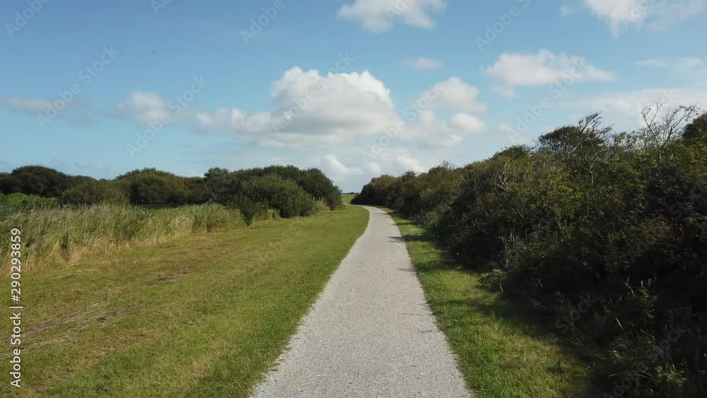 POV Cycling through nature at island Schiermonnikoog in the Netherlands POV Cycling through nature at island Schiermonnikoog in the Netherlands