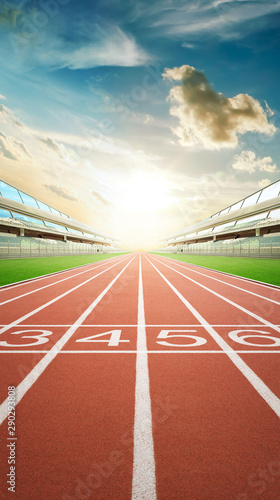 View of the infinity empty athlete running track and modern grandstand in stadium. morning scene . Vertical format .