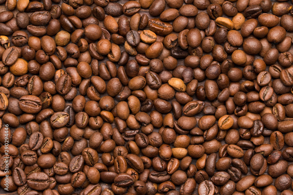 Roasted coffee beans background. Top view. Space for text. Roasted coffee beans background. Top view. Space for text.