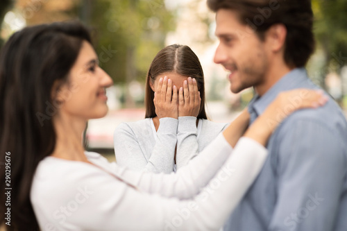 Woman crying, watching her ex boyfriend starts happy love relations