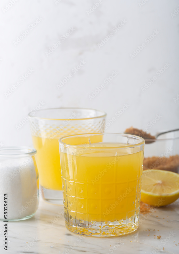 Homemade Isotonic Energy Drink and Ingredients. Glasses With Yellow Liquid, Homemade Sport Beverage Homemade Isotonic Energy Drink and Ingredients. Glasses With Yellow Liquid, Homemade Sport Beverage