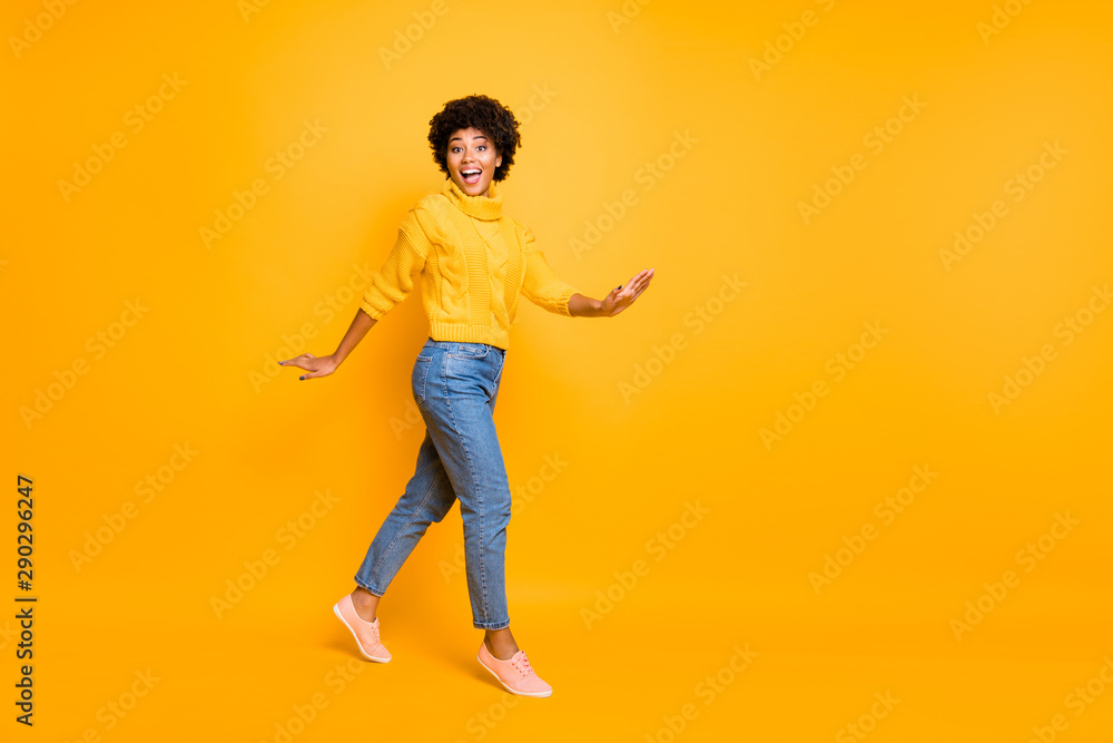 Full length body size view of her she nice attractive charming lovely cute cheerful cheery glad wavy-haired girl walking having fun isolated on bright vivid shine vibrant yellow color background Full length body size view of her she nice attractive charming lovely cute cheerful cheery glad wavy-haired girl walking having fun isolated on bright vivid shine vibrant yellow color background