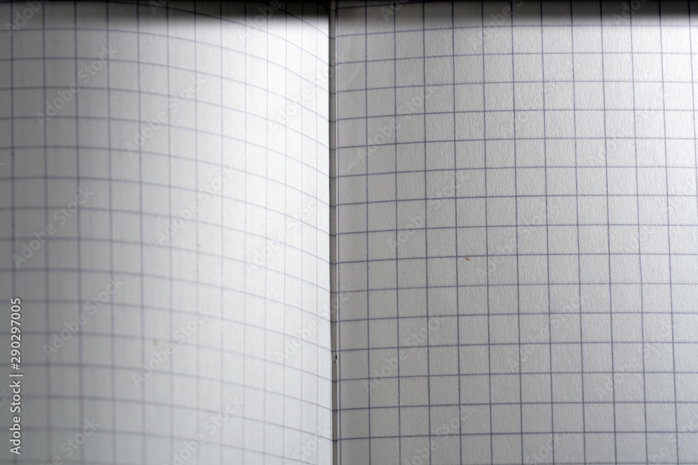 Paper made from wood into writing utensils, bound, checkered and colored Paper made from wood into writing utensils, bound, checkered and colored